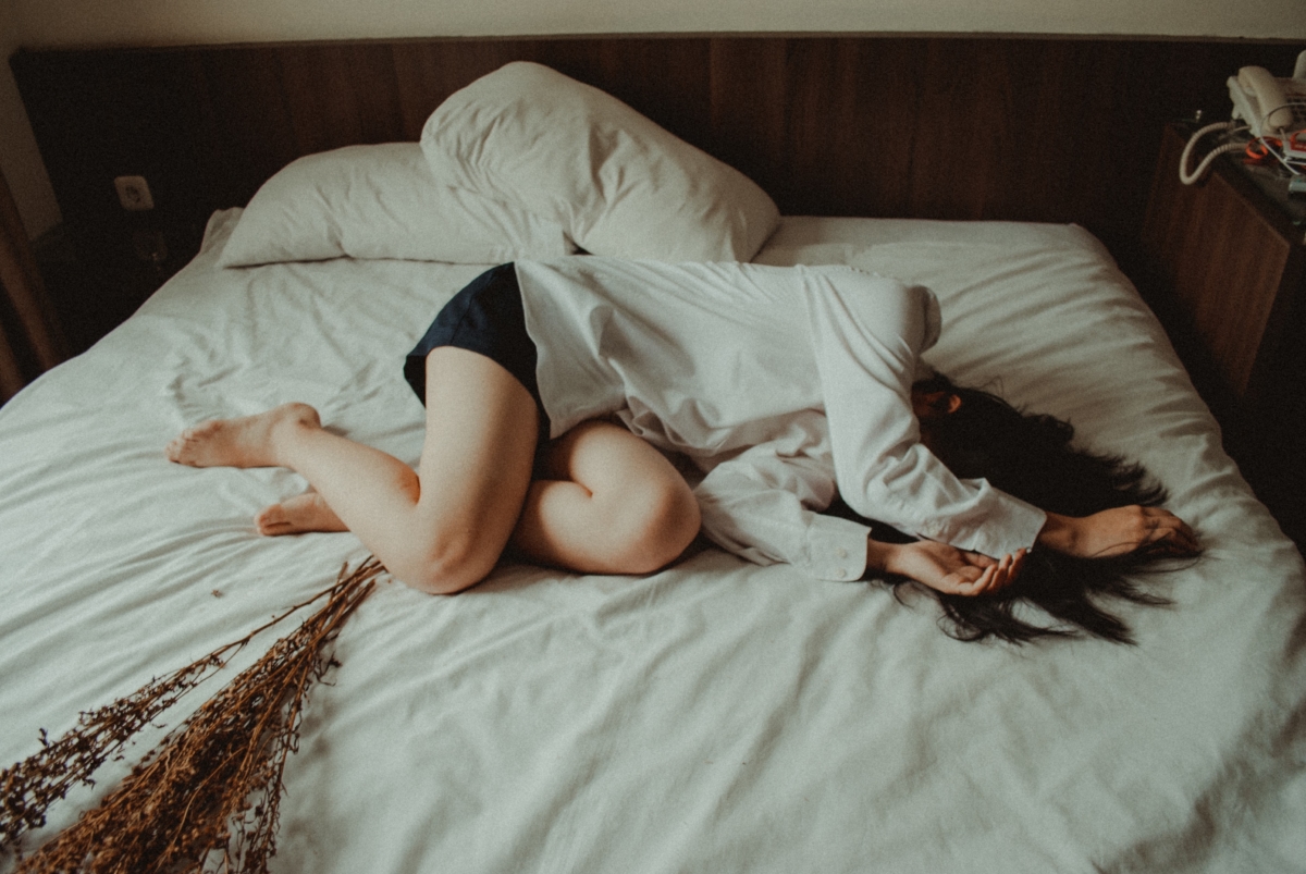 Depressed woman on bed