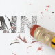 Blyant, der streger ordet PAIN ud