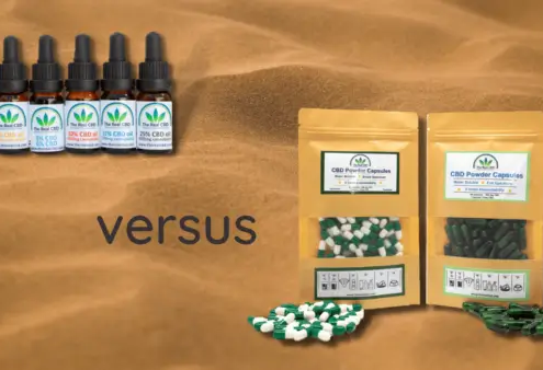 CBD olie og CBD kapsler på sand