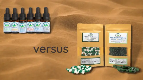 CBD olie og CBD kapsler på sand