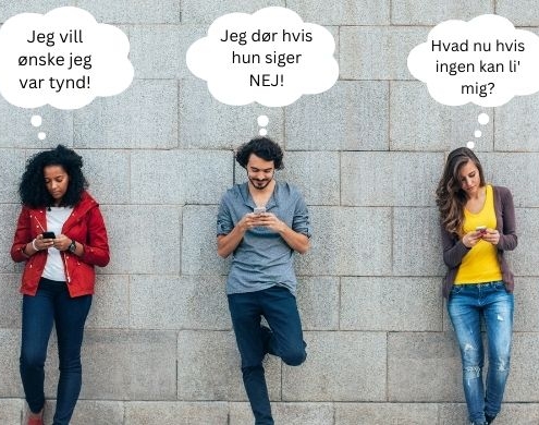 Teenagere på deres smartphones mod en mur