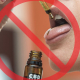 STOP skilt over en person som tager CBD olie