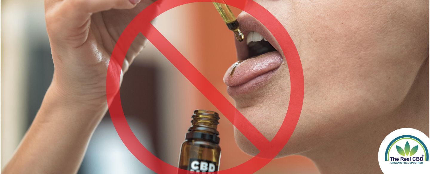 STOP skilt over en person som tager CBD olie