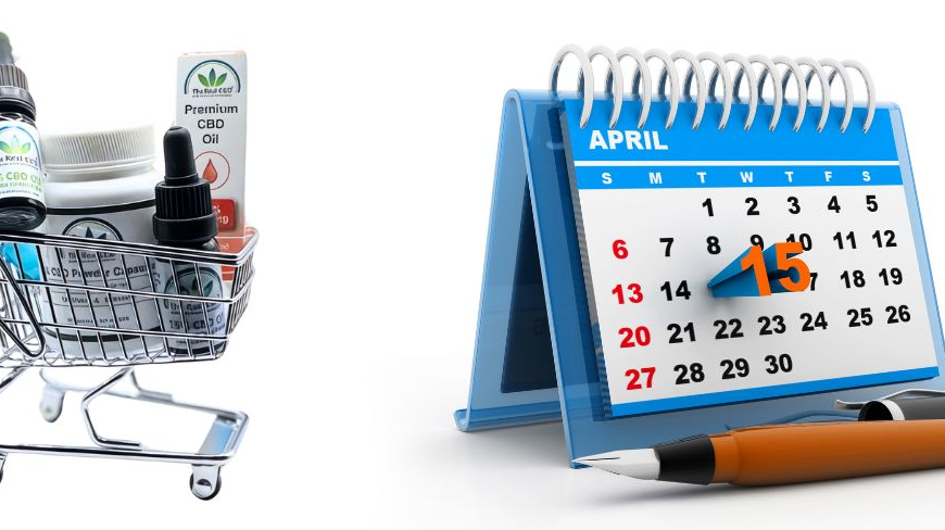 Indkøbsvogn med CBD produkter ved siden af en kalender med en nål i.
