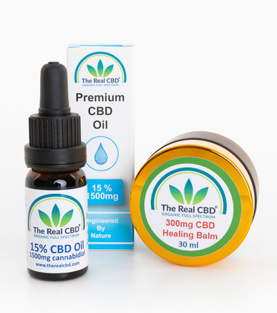 Un frasco de tintura de aceite de CBD al 15% y un bote de bálsamo de CBD de 3000 mg - The Real CBD marca
