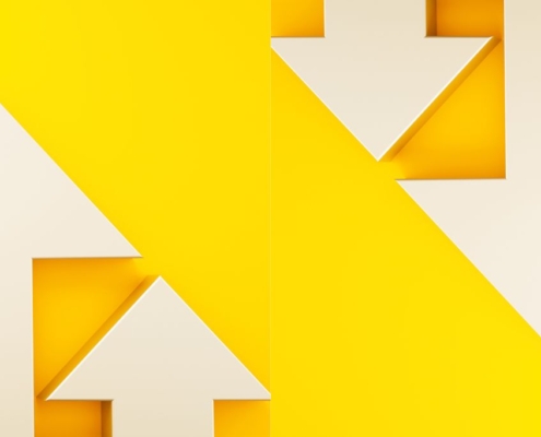 White arrows pointing up and down on yellow background