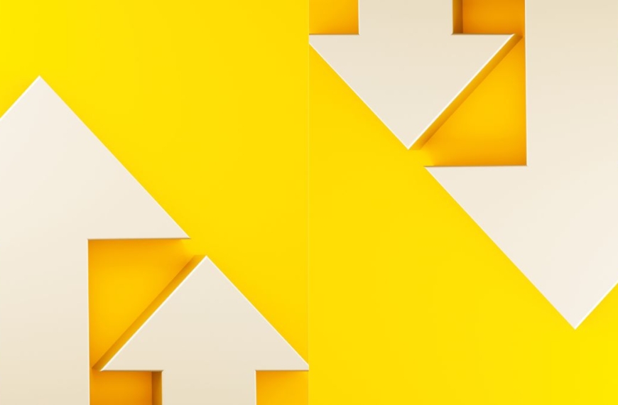 White arrows pointing up and down on yellow background