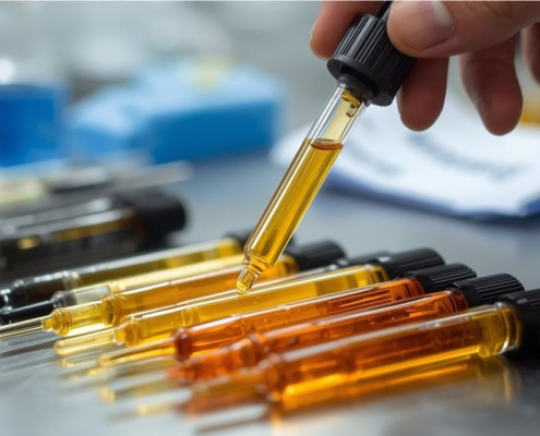 Varias pipetas con aceite de diferentes colores.