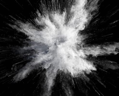 White powder exploding on a black background