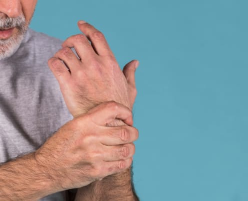 Man holding his wrist in pain