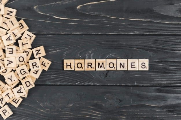 hormones-word-wooden-background
