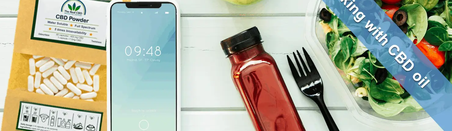 CBD capsules, smartphone and food on a table top