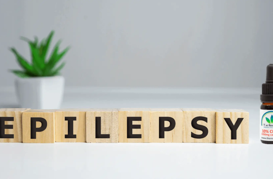 Epilepsy spelled out on wood blocks with CBD oil on the side