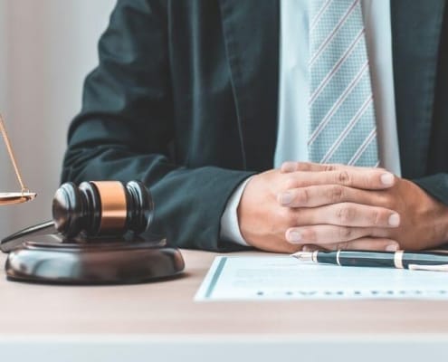 Lawyer with hammer and weight scale