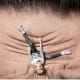 Upside down child holding onto wrinkled forehead
