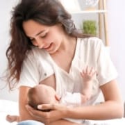 The-Real-CBD-Blog-Is-CBD-safe-when-breast-feeding Happy woman breastfeeding her child