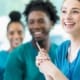 A team of happy nurses in scrubs