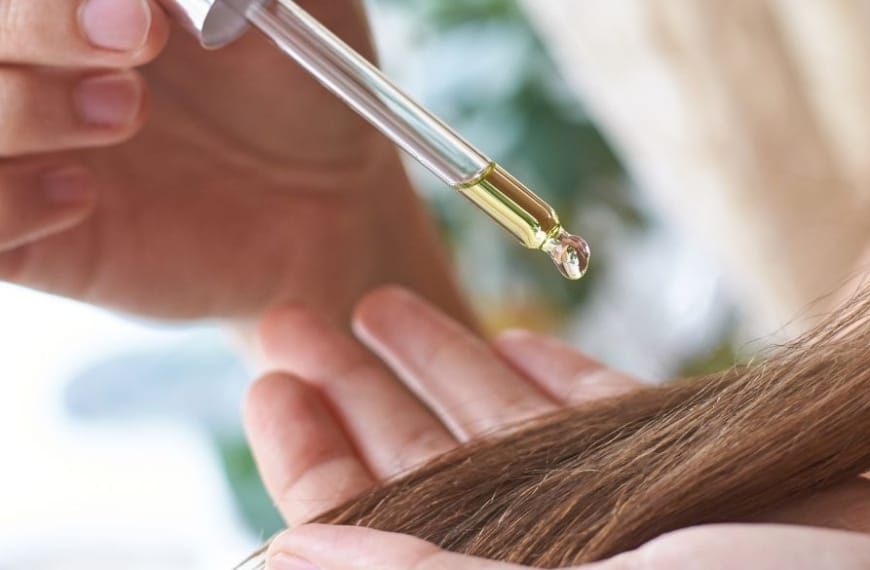 Oil dropping on to a lock of long hair