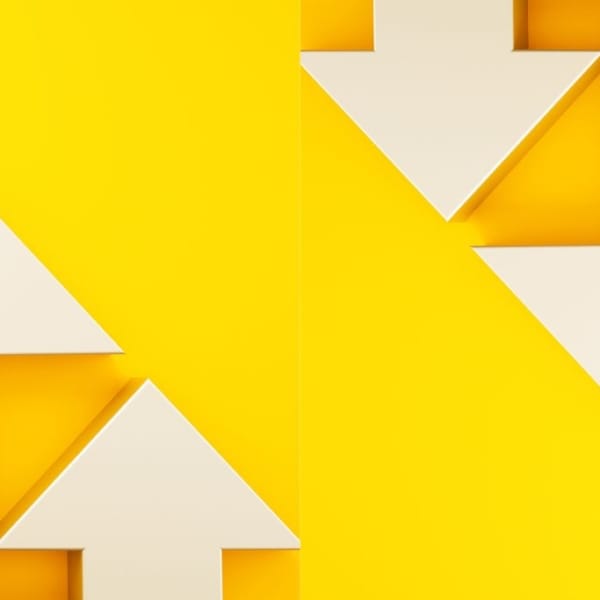 White arrows going up and down on a yellow background