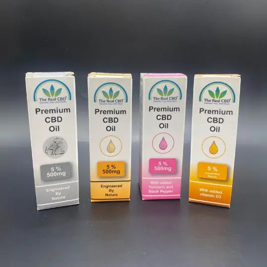 A line of 4 different 5% CBD oil boxes - The Real CBD Brand