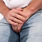 The-Real-CBD-Blodg-CBD-for-incontinence Man wetting himself while holding his crotch