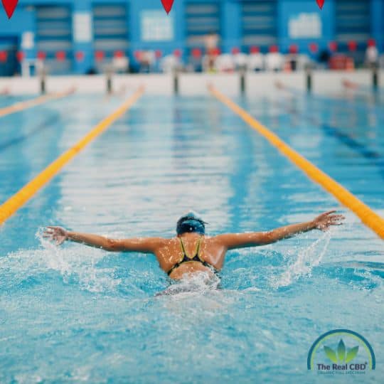 Woman in swimming competition in an indoor pool