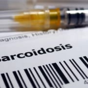 Syringe and doctors report about sarcoidosis