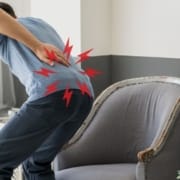 The-Real-CBD-Blog-CBD-for-sciatica Man bending over with back pain sciatica