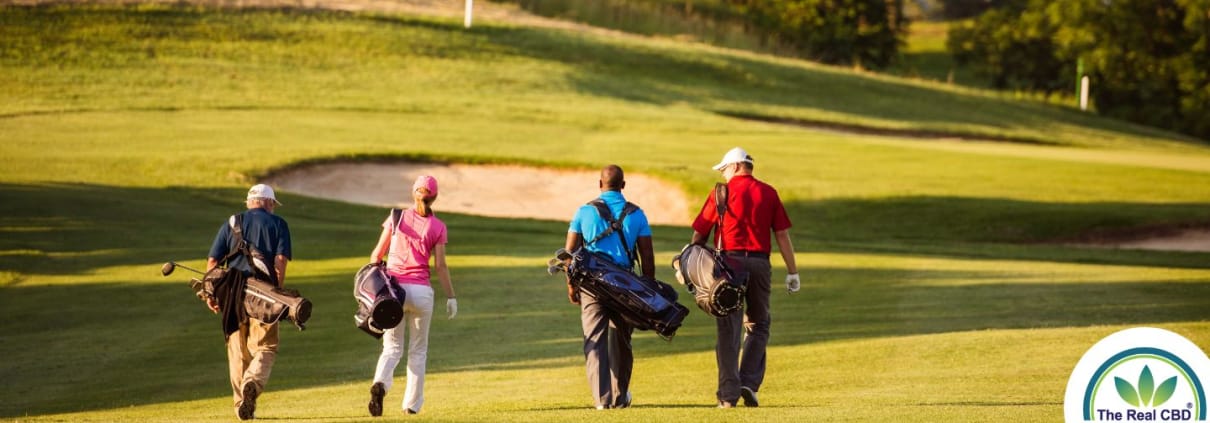 4 golfers walking across the green