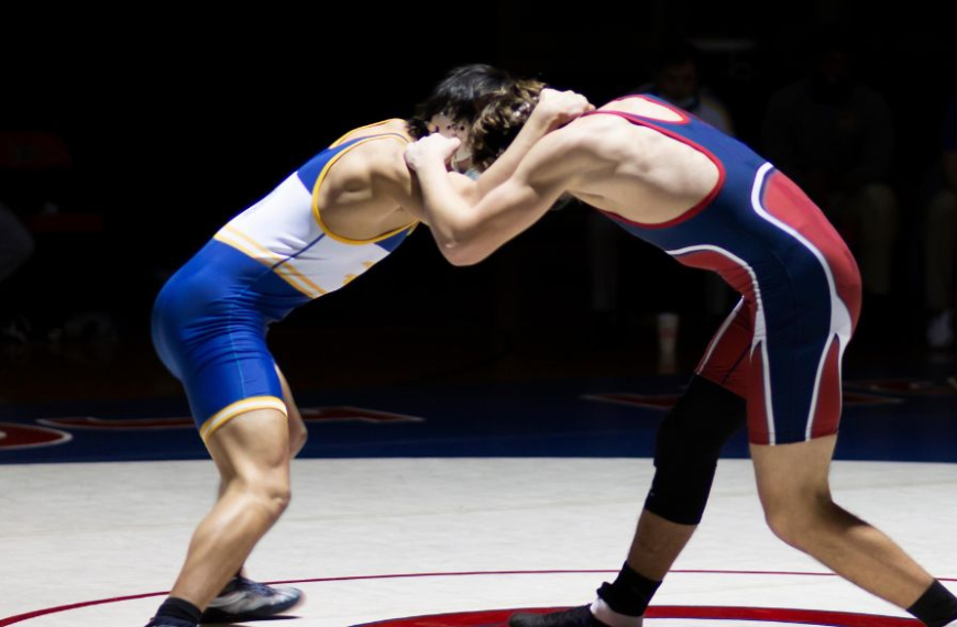 Wrestlers in a fight standing on a stage
