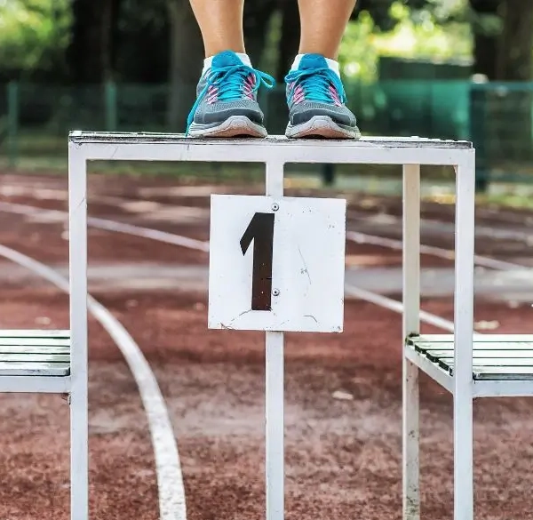 Competition podium 1 2 3 with only athletes feet visible