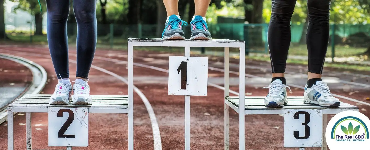 Competition podium 1 2 3 with only athletes feet visible