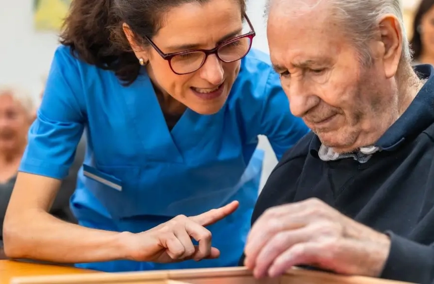 Woman helping an older man with a memory game