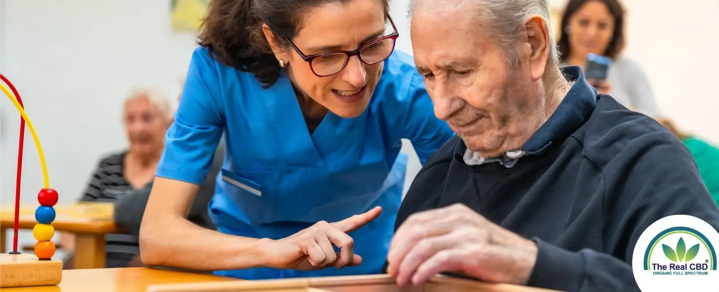 Woman helping an older man with a memory game