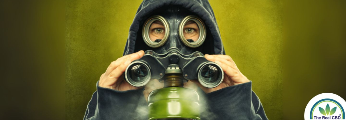 Person with a gas mask and binoculars