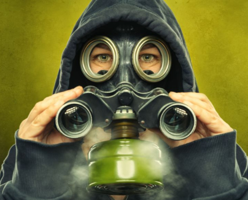 Person with a gas mask and binoculars