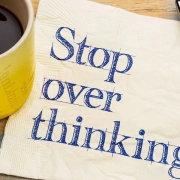 The-Real-CBD-blog-CBd-for-overthinking-rumination Coffee cup on a pc of paper saying OVERSTHINKING