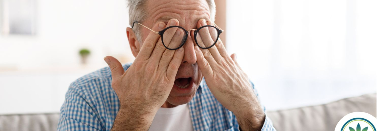 Older man rubbing his eyes