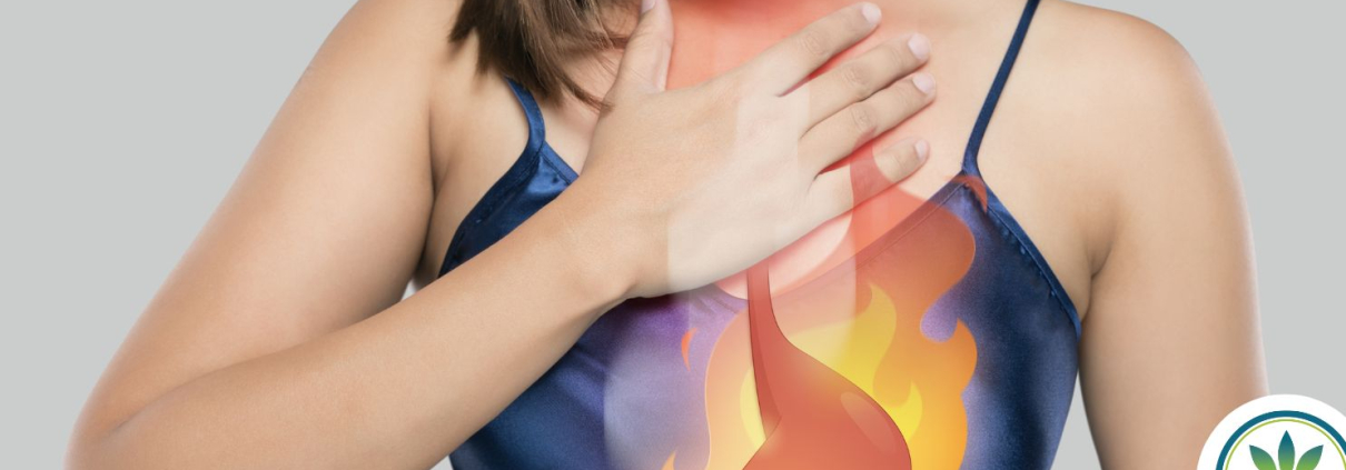 Woman holding her chest in pain showing heartburn