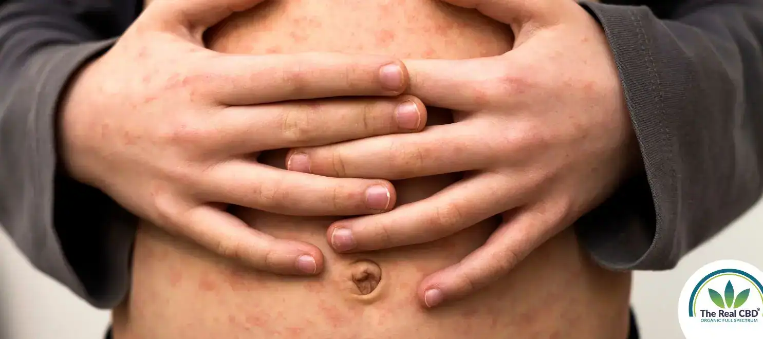 Person holding their stomach in pain