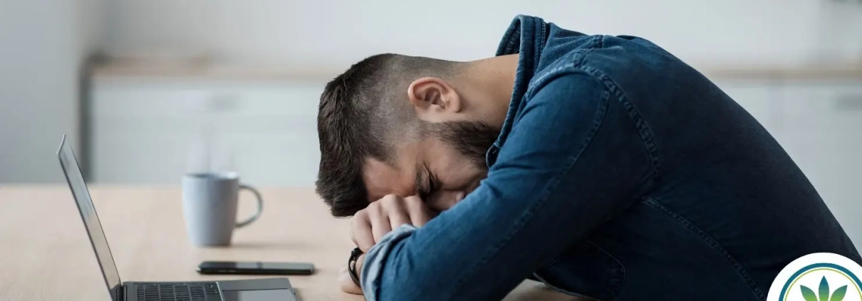 Man sleeping over an office table