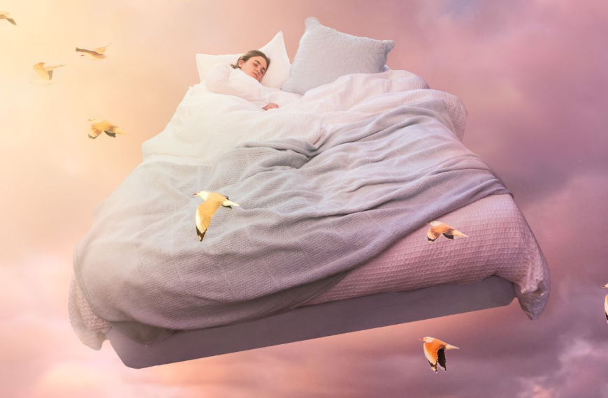 Woman sleeping in a big bed flying in the sky