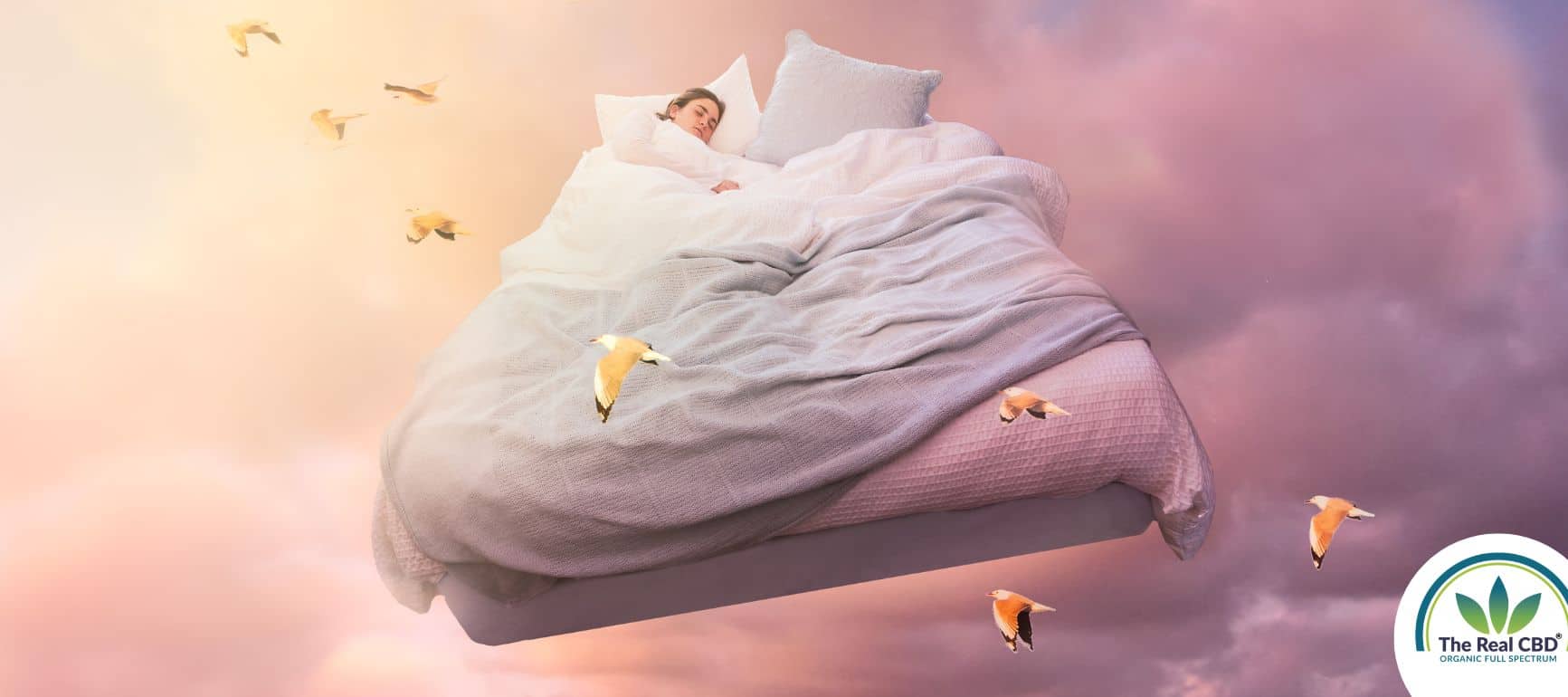 Woman sleeping in a big bed flying in the sky