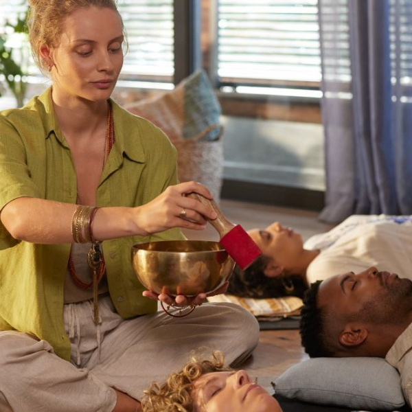 Woman performing a sound bath session