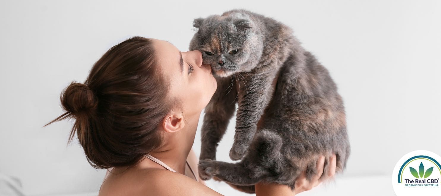 Woman kissing her cat