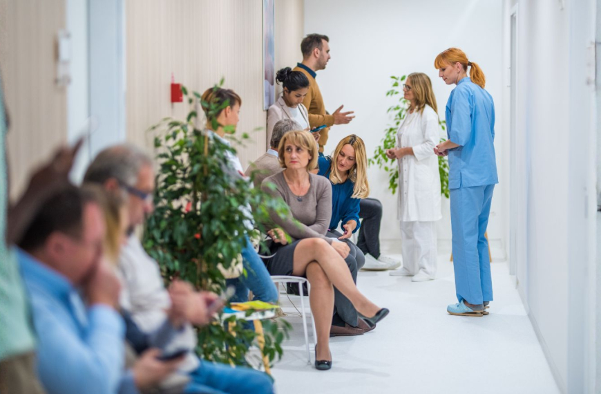 A hospital waiting room full of anxious people