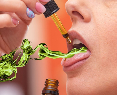 Woman having green smoke coming out of her mouth