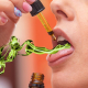 Woman having green smoke coming out of her mouth