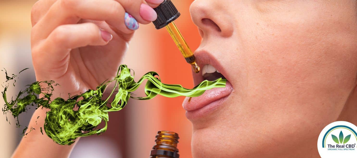 Woman having green smoke coming out of her mouth
