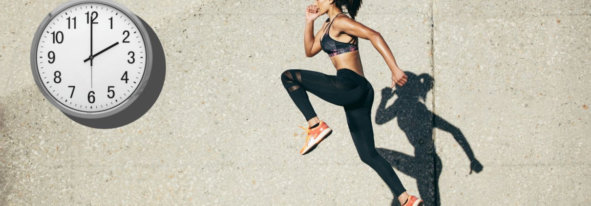 Woman and her shadow jumping infront of a wall clock